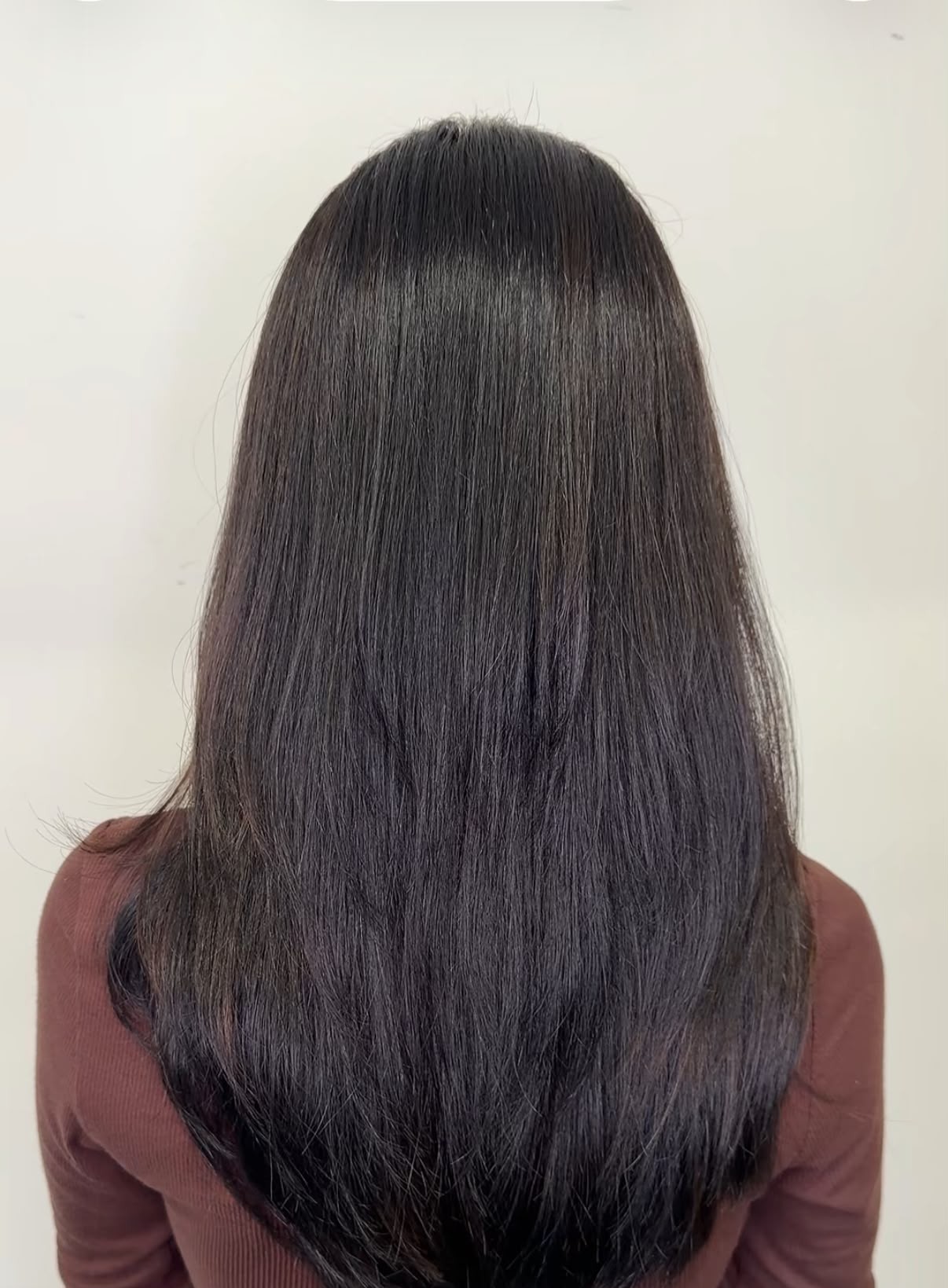 Sleek, glossy straight hair styled at Luna Hair